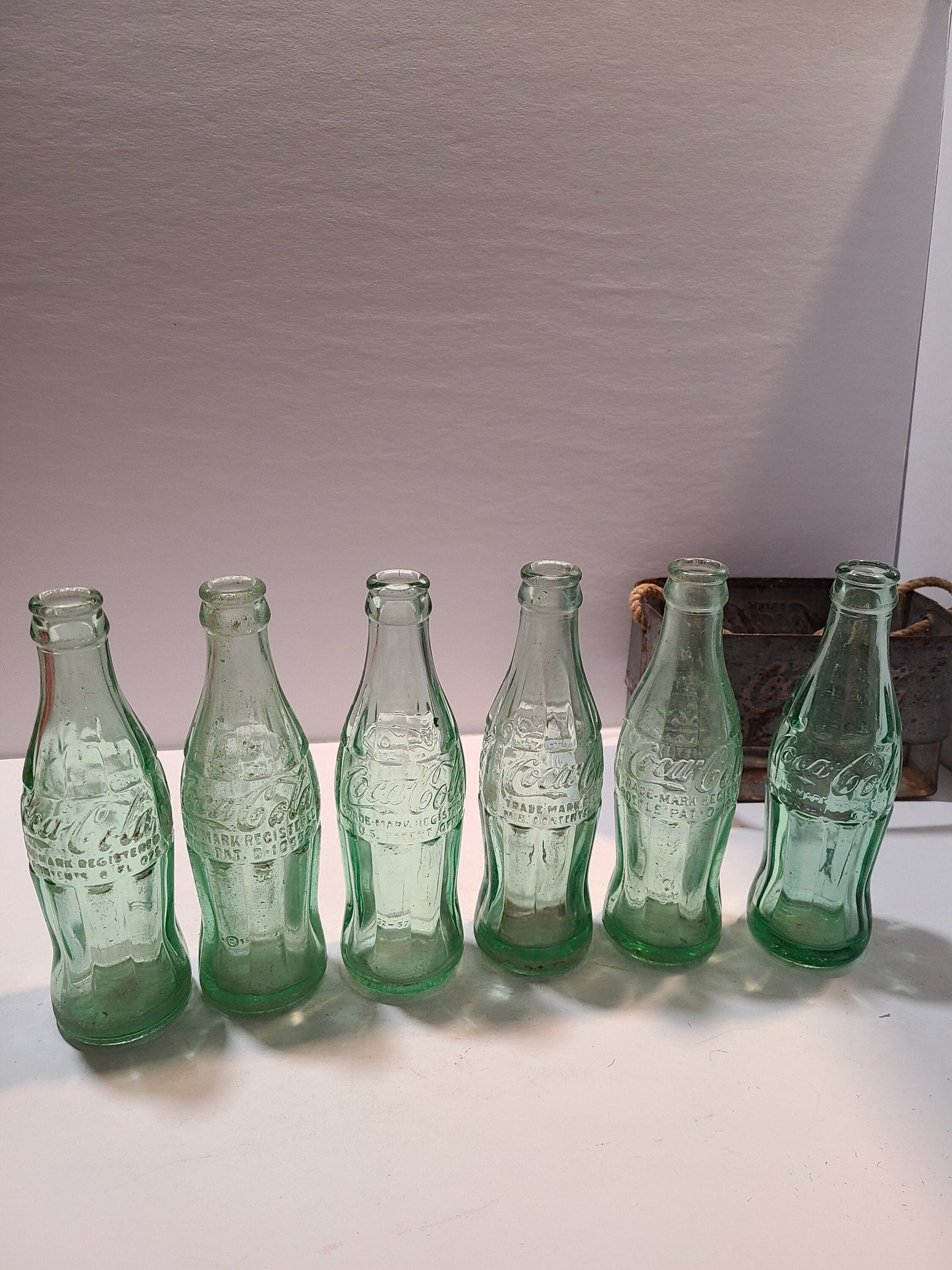 Vintage Coca cola bottles and holder