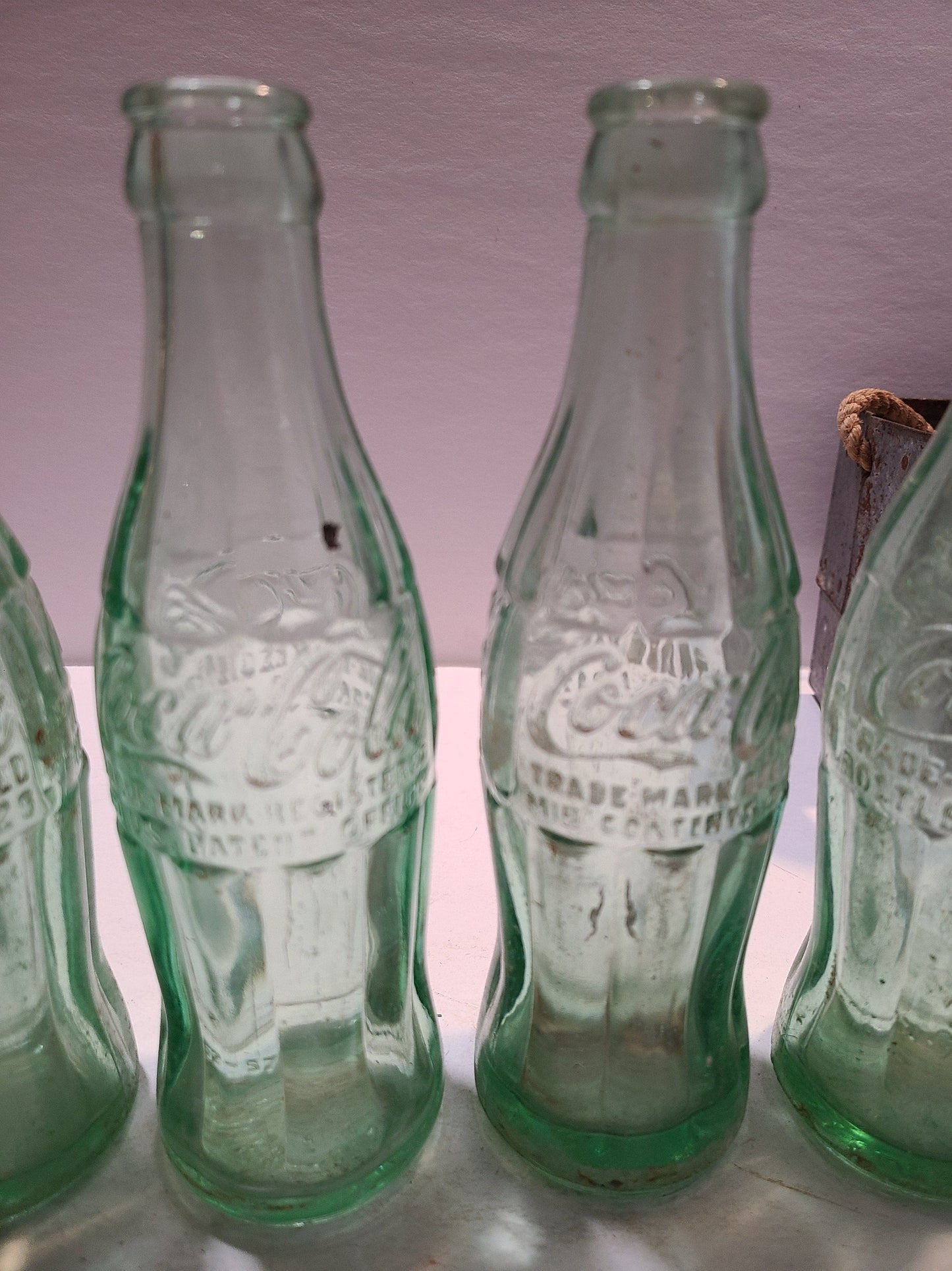 Vintage Coca cola bottles and holder