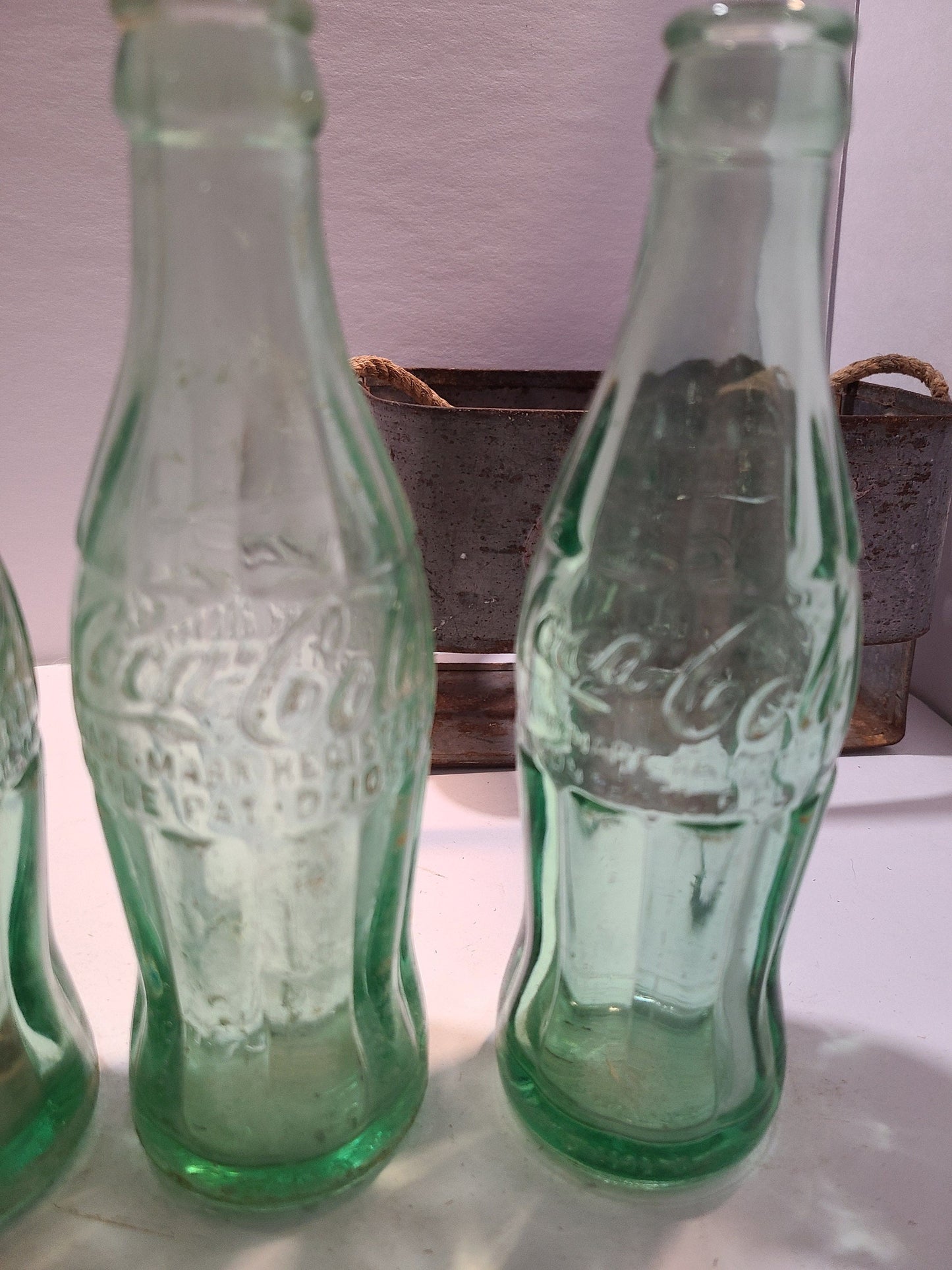 Vintage Coca cola bottles and holder