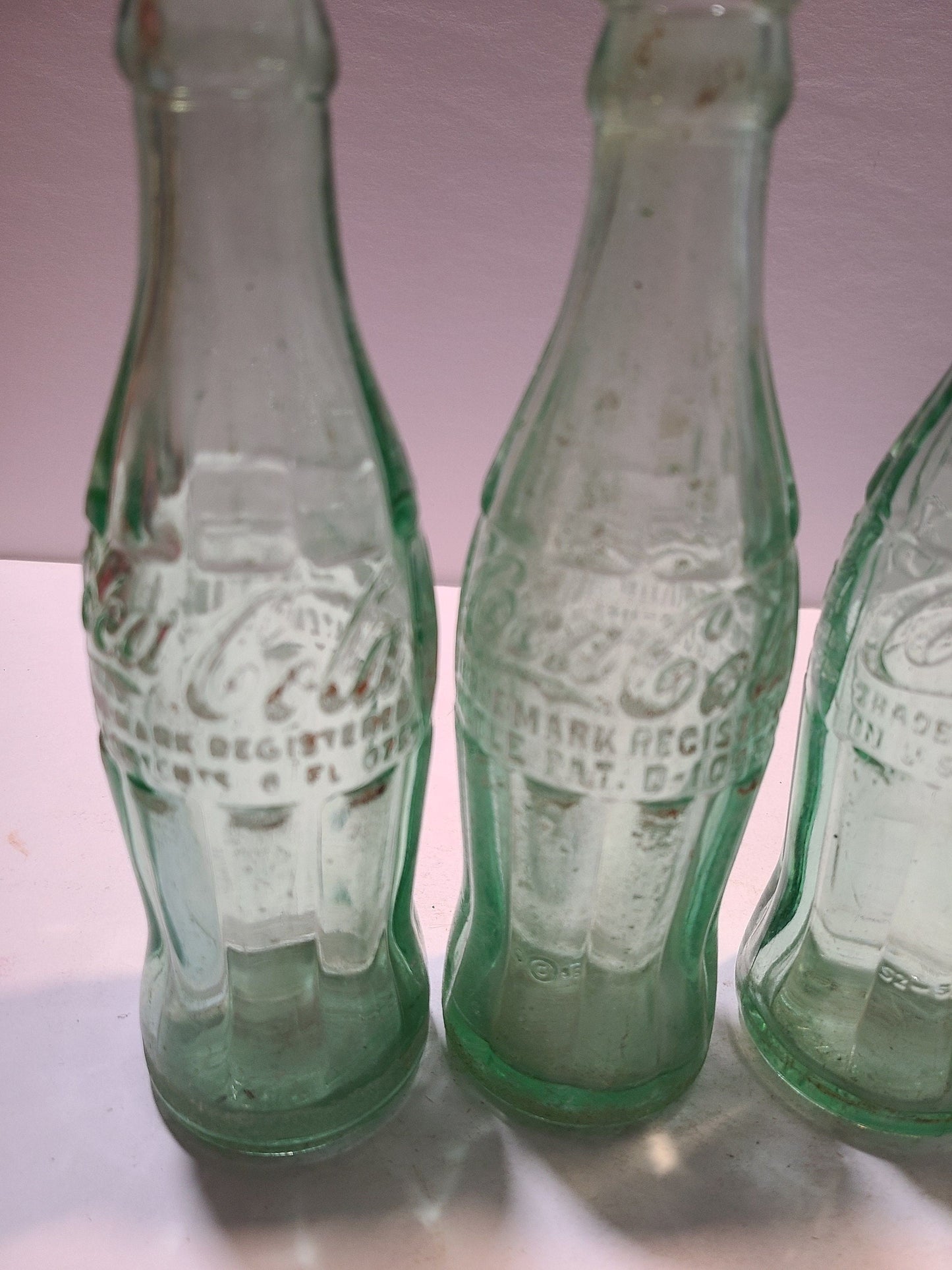 Vintage Coca cola bottles and holder