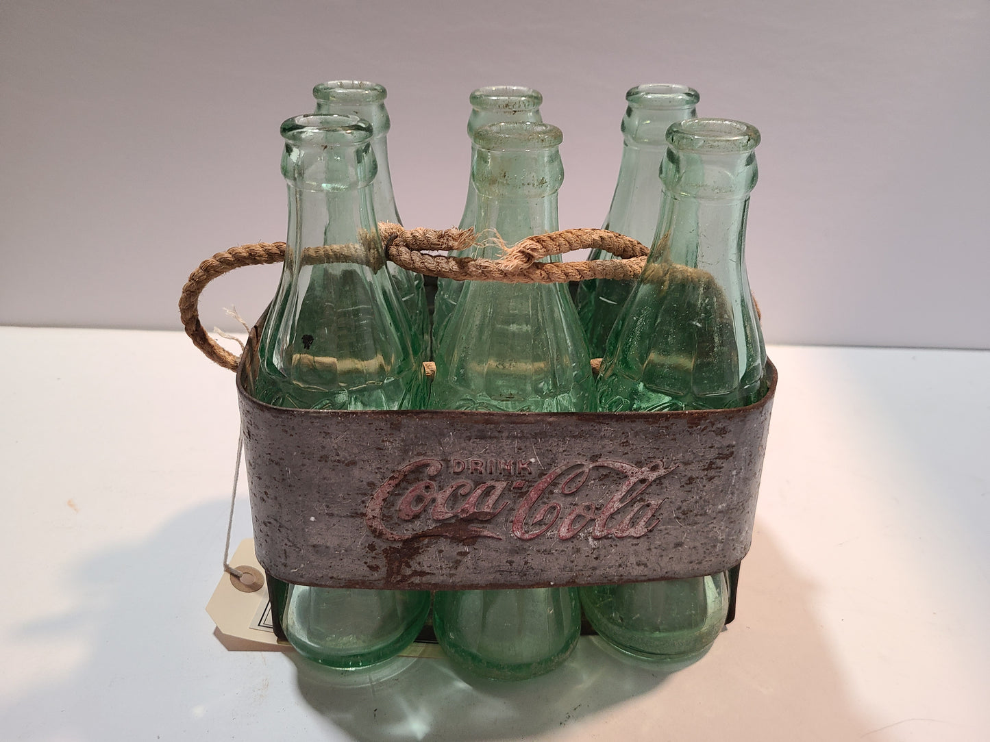 Vintage Coca cola bottles and holder